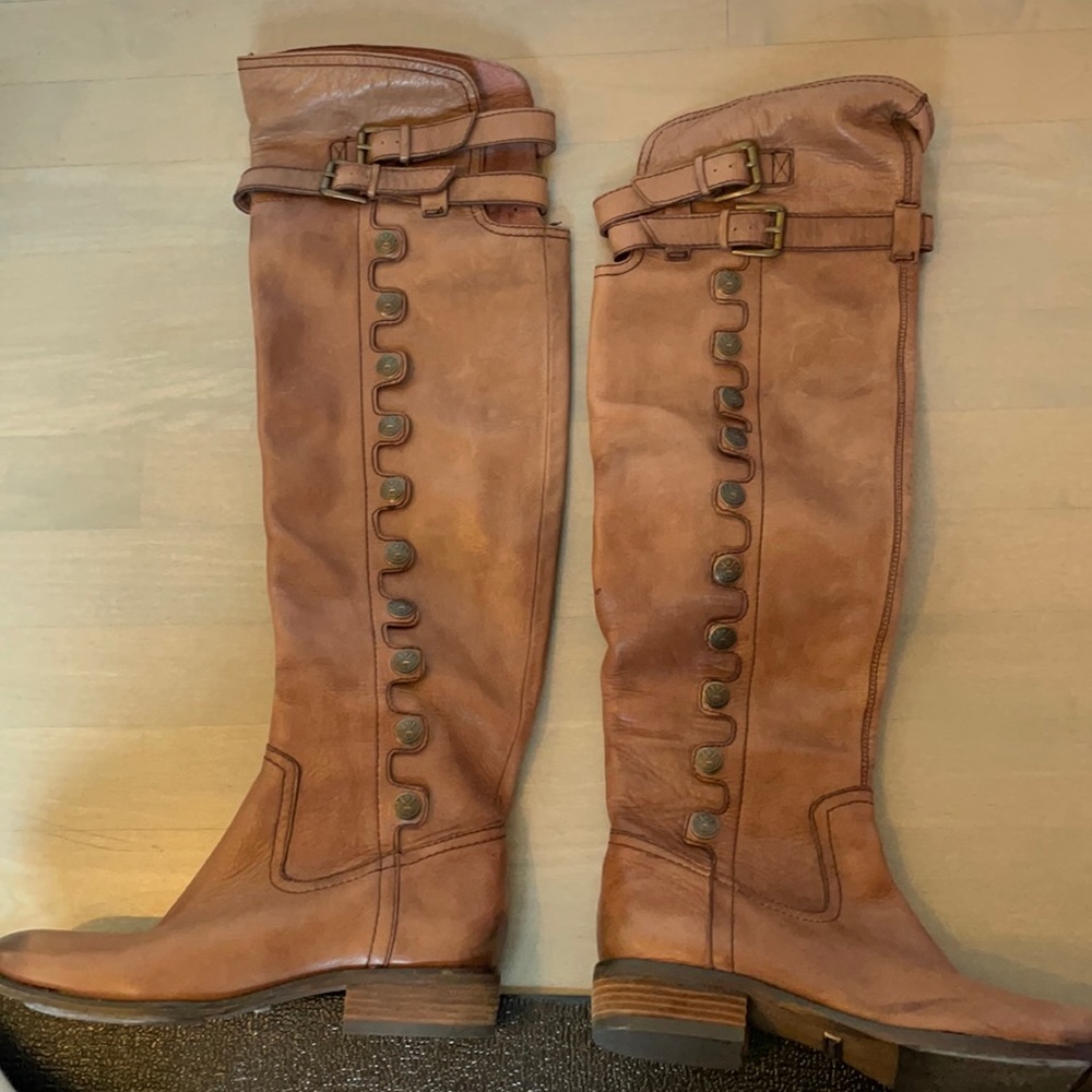 Knee high boots with button embellishment up side